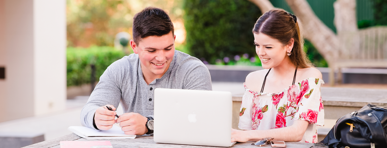 looking at dates on a laptop